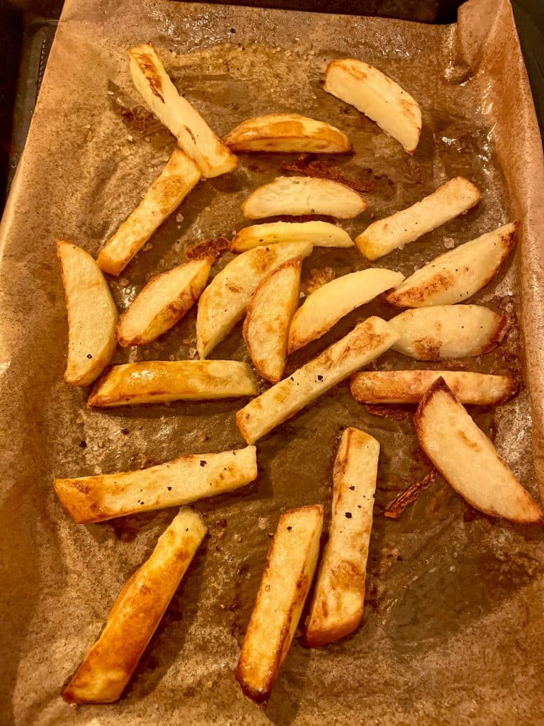 Healthy Oven Chips Slimming style baked golden brown on a baking sheet