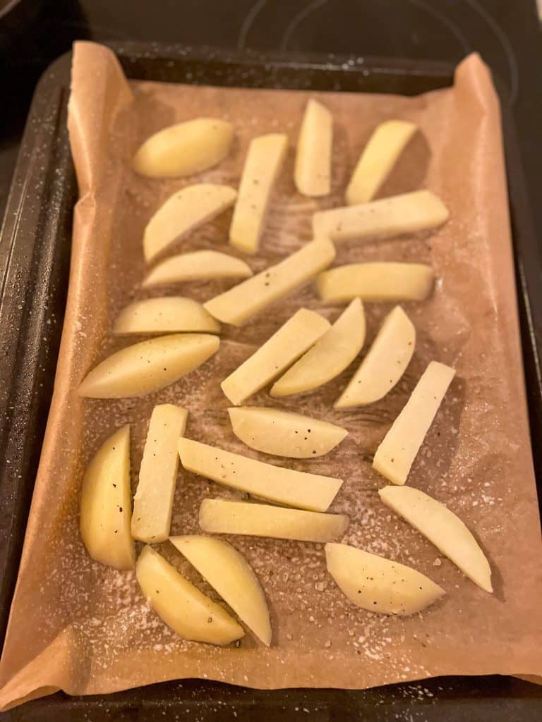 Healthy Oven Chips Slimming style parboiled on a baking sheet before baking