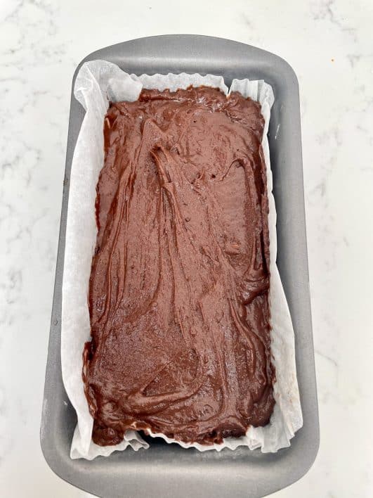 Chocolate loaf cake batter in loaf tin