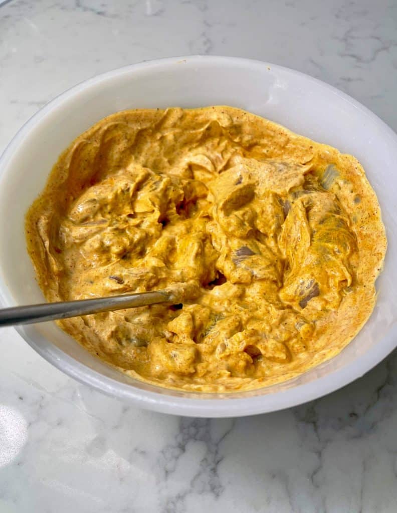 Tandoori Chicken, slimming style, raw chicken in a bowl with spices and yoghurt