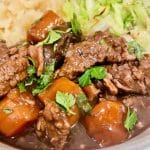 Slow cooker beef bourguignon - close up served with mash