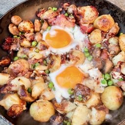 One pop fry up of new potatoes, egg, mushrooms, peas and bacon