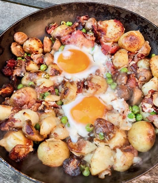 One pop fry up of new potatoes, egg, mushrooms, peas and bacon