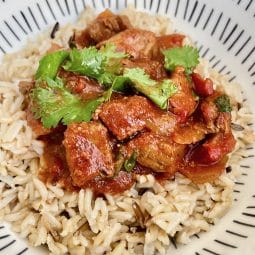 A bowl of served Slow cooker beef curry with rice