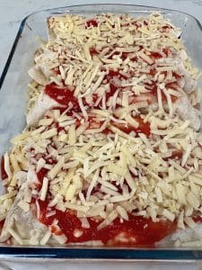 Easy beef enchiladas ready for the oven - rolled and in a baking dish