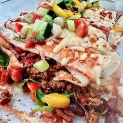Easy beef enchiladas in dish and ready to serve