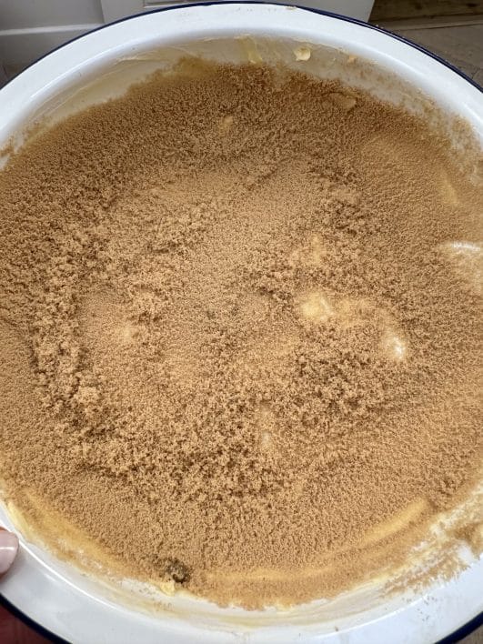 Pudding dish greased with butter and brown sugar 