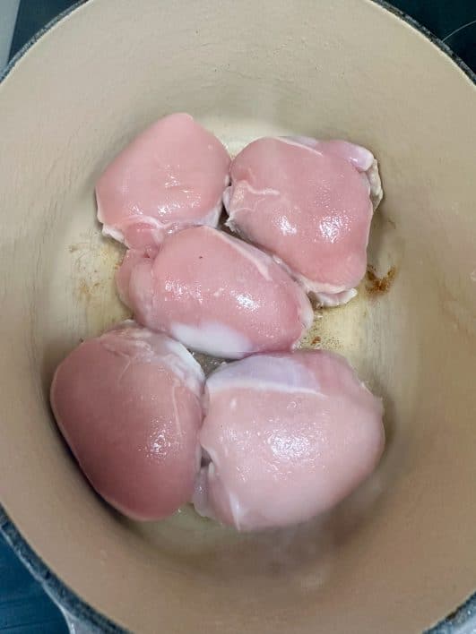 Chicken thighs in a skillet