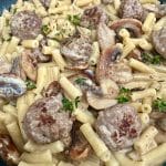 A bowl of meatballs, mushrooms and pasta