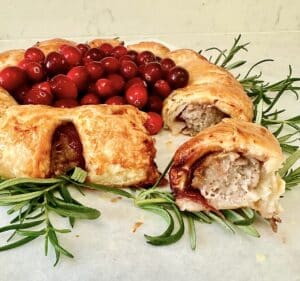 Sausage roll wreath with a section pulled out