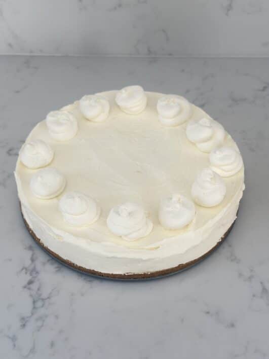 plain lemon cheesecake not decorated expect for whipped cream 