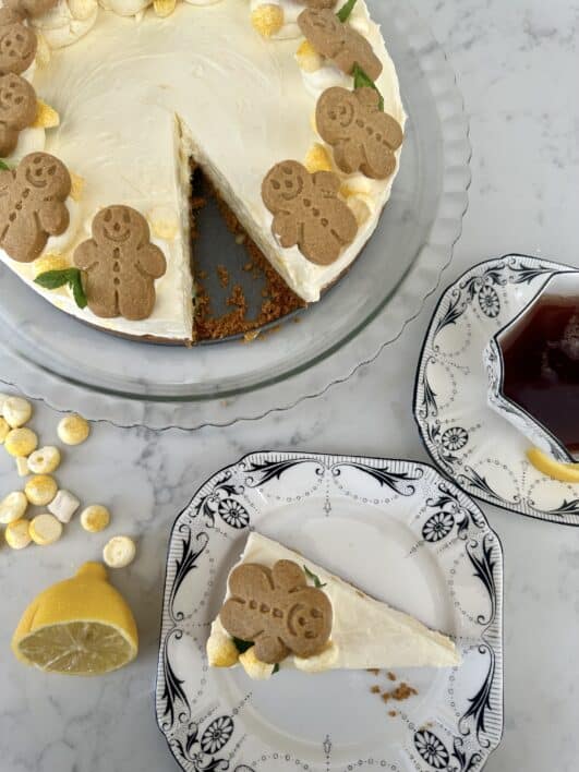 Lemon & ginger cheesecake served with a slice out and a cup of tea 