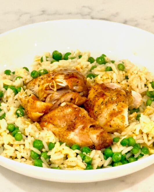 Buffalo chicken thighs served with egg fried rice